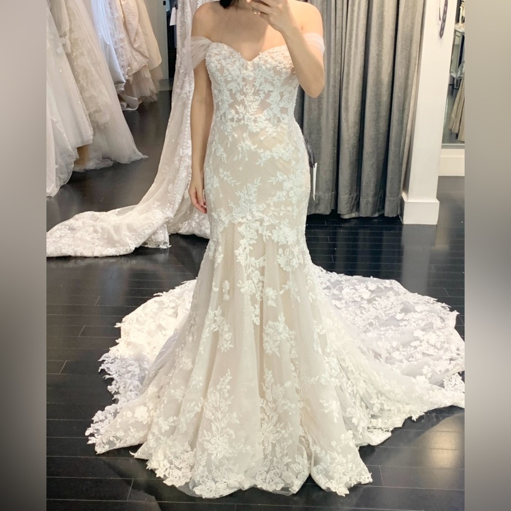 Martina Liana mermaid wedding dress in sheer bodice with ivory skirt.